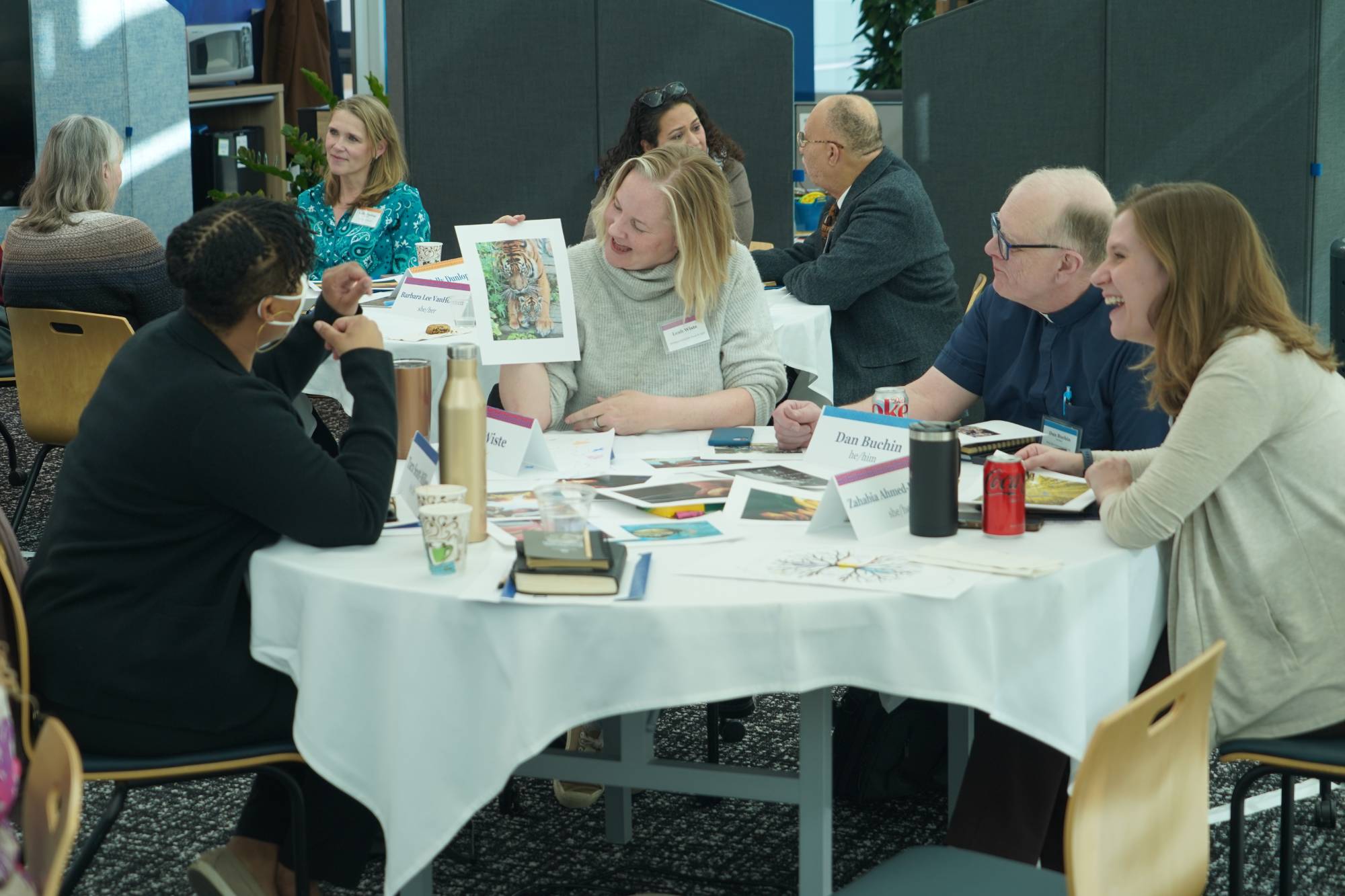 People Taking at a table during April Convening